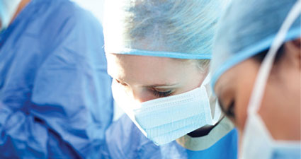 Head shot of surgeons operating on a patient